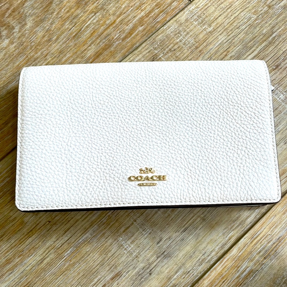 Brand new coach purse convertible from clutch to crossbody.